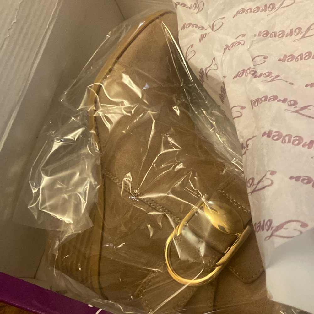 Brand new light brown shoes, never worn. Size 5.